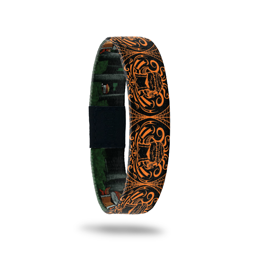 Product photo of the outside of 2020 - Day 4 - Zennifer: black and orange design with repeating orange furry monster with 4 tentacles holding a coffee cup