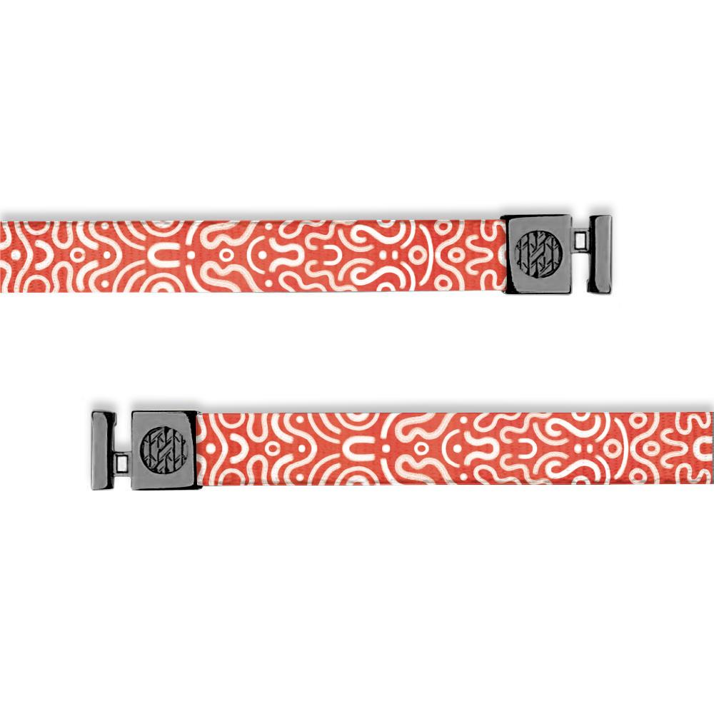 Bright red white white abstract swirls and dots all over. Has gunmetal aglets