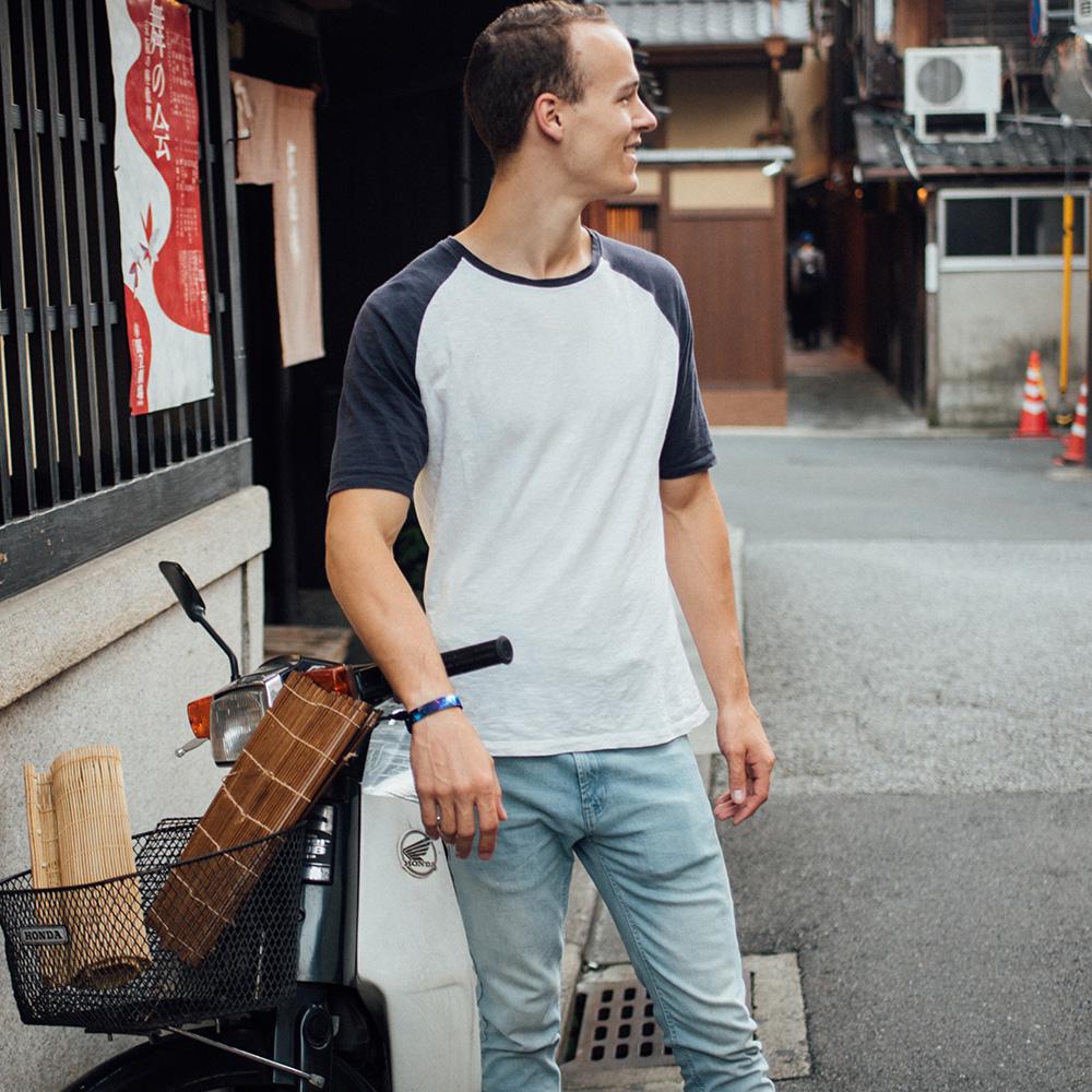 Lifestyle image of someone in front of a shop wearing Fighter